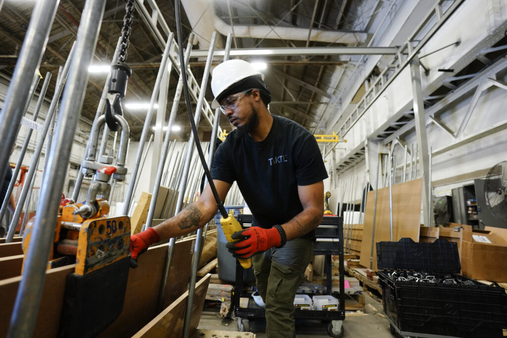 Army veteran at work in a crating department in Turtle Creek